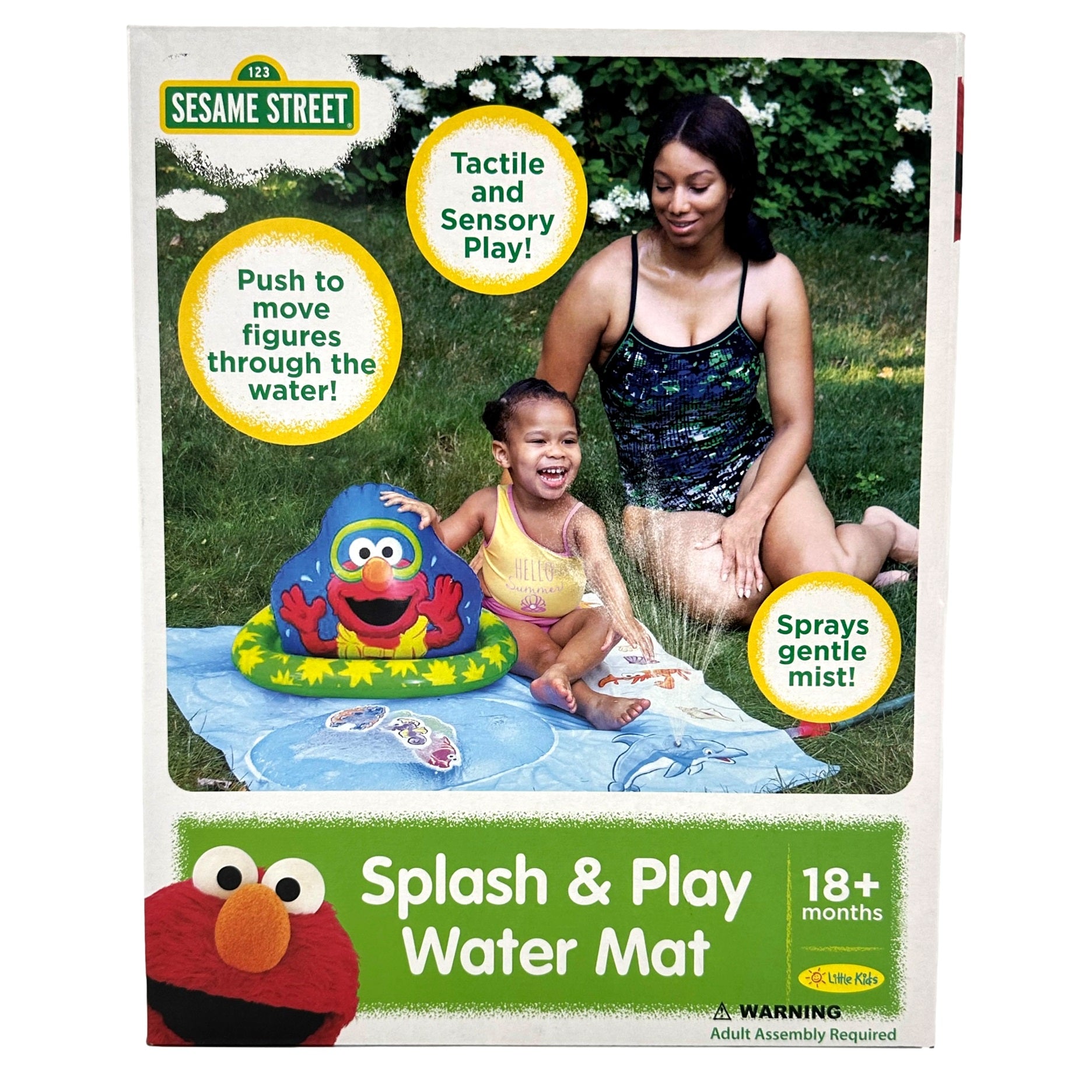 A Sesame Street Splash & Play Water Mat box featuring a woman and child playing with the water mat, with Elmo on the box.